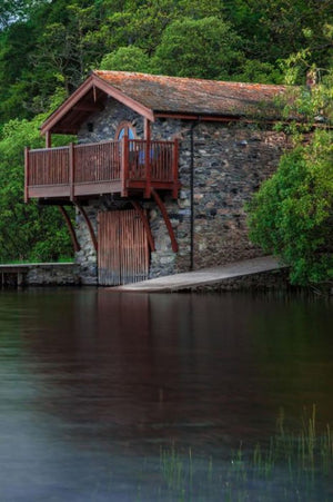 BOAT HOUSE: A building especially designed for the storage of boats, normally smaller craft for sports or leisure use. These are typically located on ... stored are rowing boats or small motor boats.